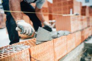 Builder Laying Bricks